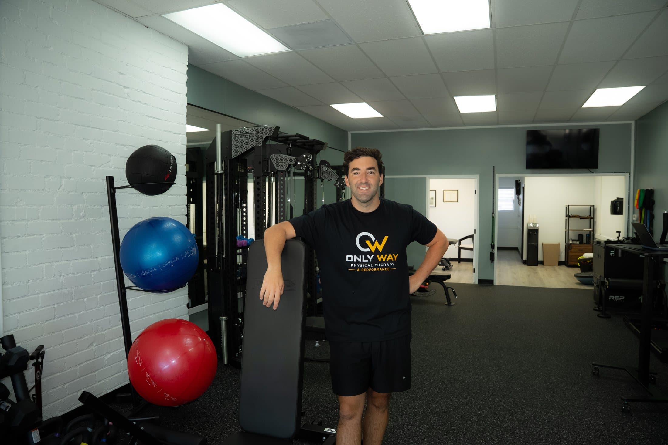 The Only Way PT performance floor — force rack, functional trainer, and recovery tools